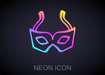 Glowing neon line Festive mask icon isolated on black background. Merry Christmas and Happy New Year. Vector