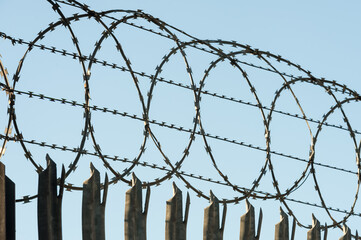 razor-wire fencing around a high security enclosure