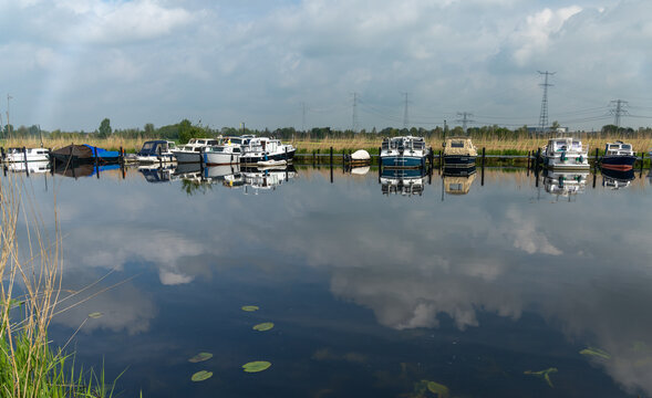 colorful boats moored in the canals of South Holland