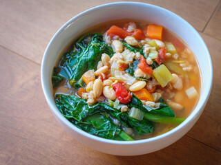 Tuscan Bean and Kale Soup. Healthy Homemade Vegetarian Vegan Food with Bean, Farro,  Carrot, and...
