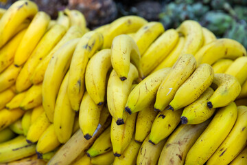 Bundles of ripe sweet bananas at farmers market