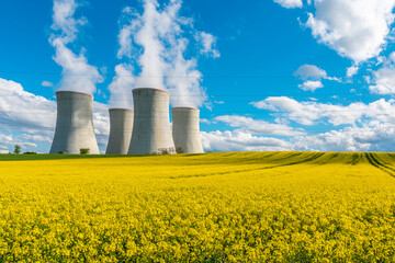 Cooling towers of a nuclear power plant in beautiful summer landscape. Nuclear power station...