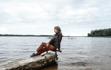 young woman near the water river horizon autumn water body of water leather j