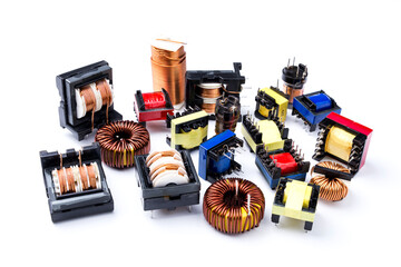 Set of toroidal inductors with copper wire and electric transformers, electronic component,...