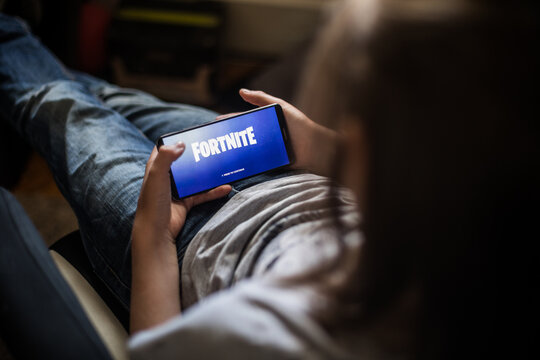 Illustrative editorial image of child playing Fortnite