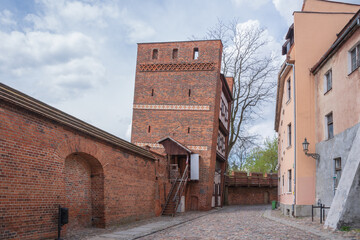 Leaning Tower in Torun, a Gothic city in Poland on the Wisla River  - obrazy, fototapety, plakaty