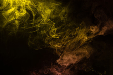 Yellow and pink steam on a black background.