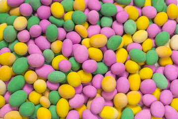 Group of colorful peanuts in glaze.