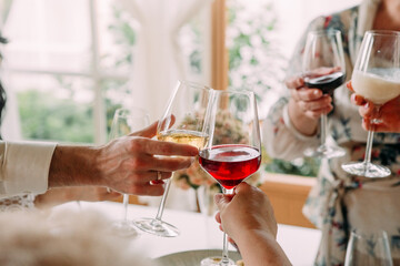 festive toast glasses together group people cocktails