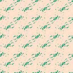 Seamless pattern with a pattern of green spots of paint on a beige background. Vector. Use for fabric, wallpaper, wrapping paper, napkins, diapers, backdrops.