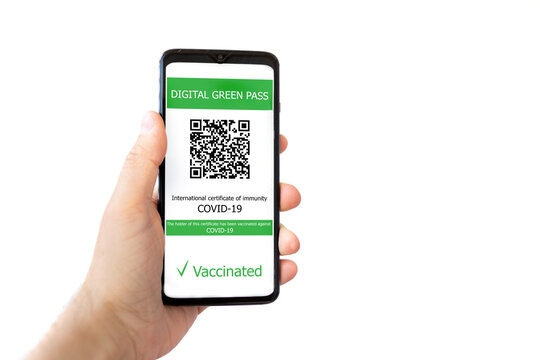 Digital health passport COVID 19 immunity on smartphone in man hand. Isolated over white. Concept of coronavirus vaccination