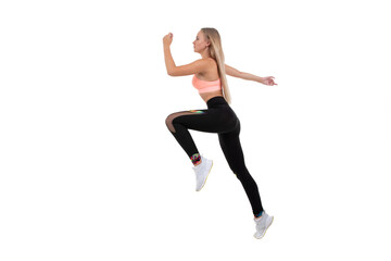 Fototapeta na wymiar A sporty young woman in a pink top, leggings and sneakers does exercises on a white background