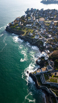 French west coast Bretagne sunny day with waves. Aerial photography with castle houses