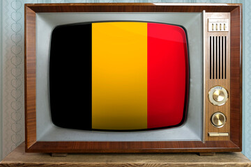 old tube vintage TV with the national flag of Belgium on the screen, stylish 60s interior, the...