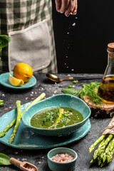 Tasty asparagus soup, Green summer vegetable soup. Food recipe background. Close up