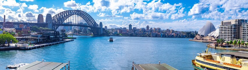 panorama View if Sydney Harbour Picture taken from Cahill Expressway Circular Quay NSW Australia. Ferry boats partly cloudy skies