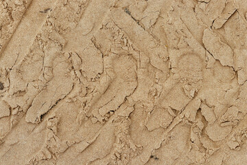 Tractor tire track on sand