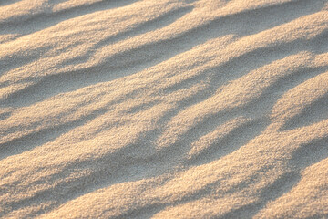 Sand dunes in the desert, natural abstract background, closeup texture