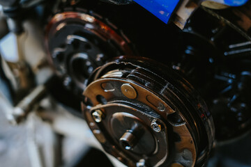 Motorcycle engine clutch repair damaged parts.