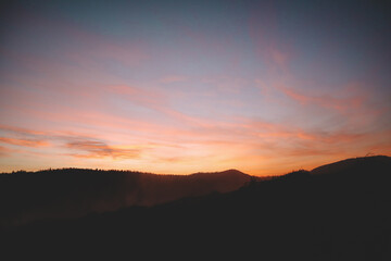Sunset in the mountains. View of Mount Pikuy. Ukrainian Carpathians in spring.