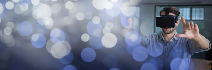 Blue sparkling transition over a man using vr headset, virtual reality concept