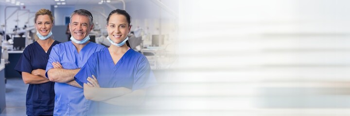 Composition of smiling male and female dentists in surgery with blurred light trails