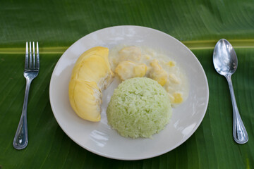 Thai sweet sticky rice with Durian.dessert popular in Thailand.Sticky rice made from pandan leaves