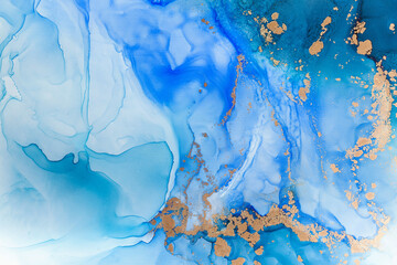 Abstract blue background with gold pigments. The technique of alcoholic ink. Watercolour painting. 