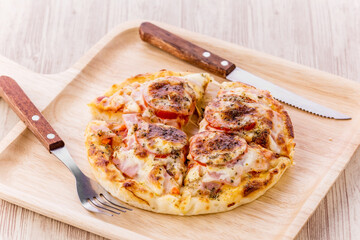 Mini pizza with sausage and cheese