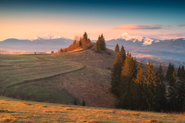 Distant snovy mountains in a carpathian alpine valley