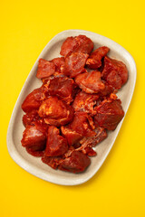 marinated meat on white dish