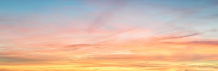 Clear blue sky. glowing pink and golden cirrus and cumulus clouds after storm, soft sunlight. Dramatic sunset cloudscape. Meteorology, heaven, peace, graphic resources, picturesque panoramic scenery - 434129648
