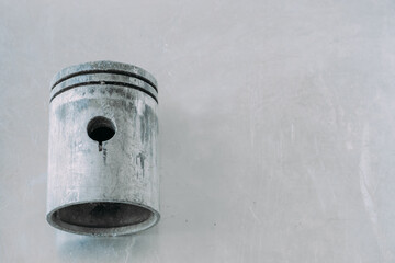 Broken piston in scratches, on a metal background. There is a space. close-up from above.