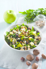 Salad with apples dandelion and dried fruit (ph. Archivio Collection)