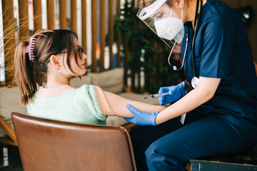 Caucasian woman patient getting vaccinated against coronavirus receiving covid vaccine....