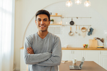 Portrait of smart smiling Caucasian man standing with arms folded at home posing for photos with copy space. Attractive middle age female freelancer looking at camera - 434131672