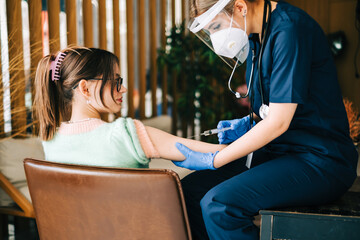 Caucasian woman patient getting vaccinated against coronavirus receiving covid vaccine....
