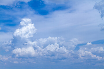 Naklejka na ściany i meble Heavy clouds and blue sky. Blue sky with white clouds.