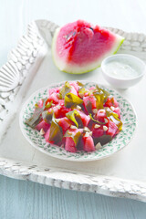 Salad with watermelon wakame seaweed red chili peppers and cashews (ph. Archivio Collection)