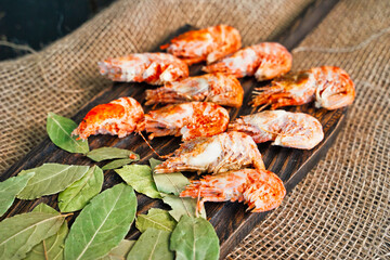 Greenland prawns on a wooden cutting board 