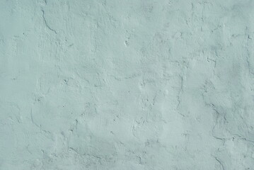 background light blue wall with small scratches