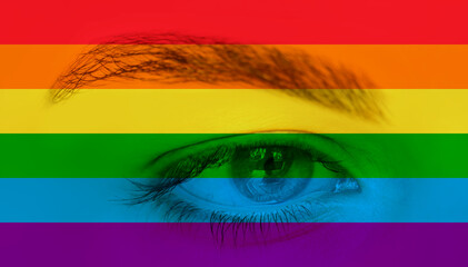 Obraz premium Close up of eyes with LGBT Pride Rainbow flag isolated