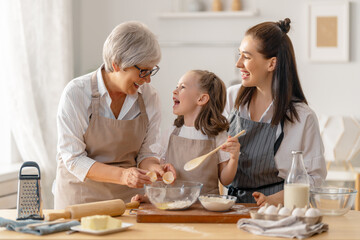 Obraz na płótnie Canvas family are preparing bakery together
