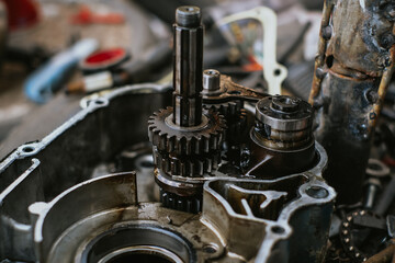 The engine is repairing a damaged motorcycle engine for reuse.