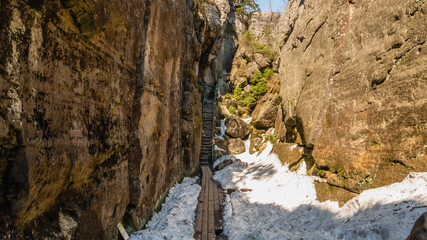 Stolowe Mountains National Park. Path in Rock Labyrinth hiking trail in Szczeliniec Wielki, Hell -...