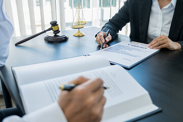  Judge gavel with Justice lawyers having team meeting at law firm background. Concepts of Law and Legal services.