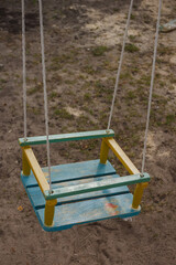 Colorful children's swing in the courtyard