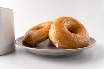 glazed donuts and coffee image. front view