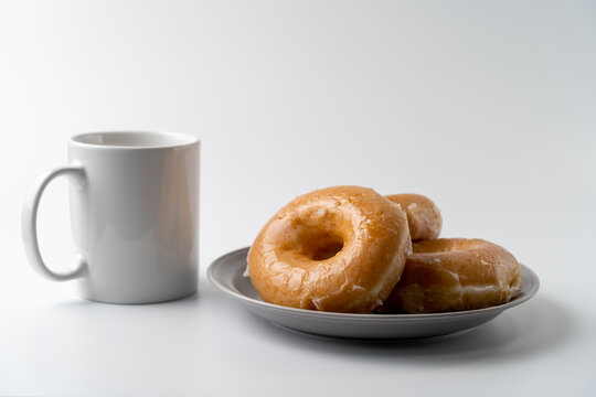 glazed donuts and coffee image. front view