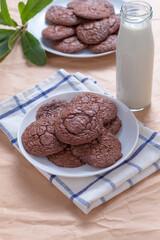cookie on white plate with milk